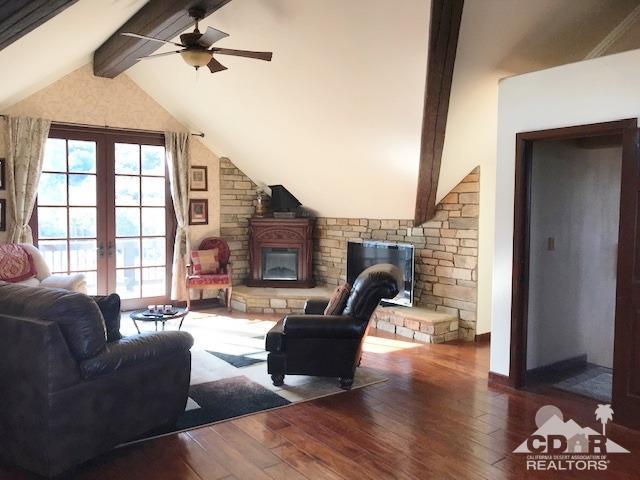 59373 Hop Patch Spring Road Mountain Center, CA 92561 - Photo 19 of 41 a living room with furniture and a fireplace
