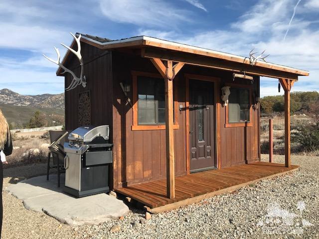 59373 Hop Patch Spring Road Mountain Center, CA 92561 - Photo 32 of 41 a view of a house with entryway