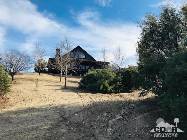 59373 Hop Patch Spring Road Mountain Center, CA 92561 - Photo 39 of 41 a front view of a house with a yard
