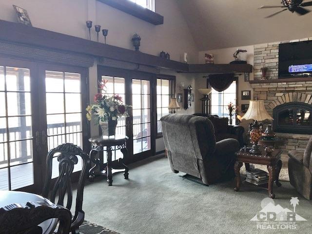 59373 Hop Patch Spring Road Mountain Center, CA 92561 - Photo 6 of 41 a living room with furniture a fireplace and a flat screen tv