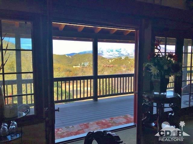 59373 Hop Patch Spring Road Mountain Center, CA 92561 - Photo 8 of 41 a view of a porch with wooden floor