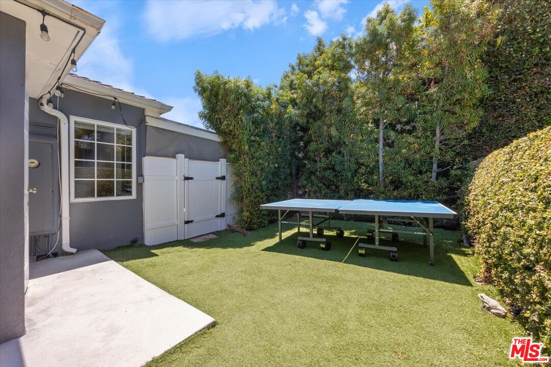 14041 Roblar Road Sherman Oaks, CA 91423 - Photo 39 of 47 a backyard of a house with table and chairs