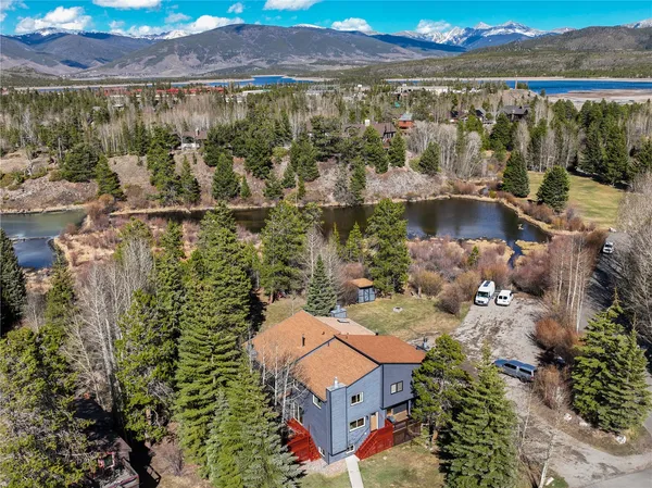 a aerial view of a house with a lake view