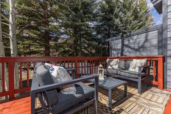 a view of a balcony with furniture