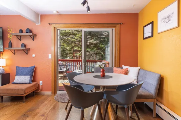 a view of a dining room with furniture window and outside view