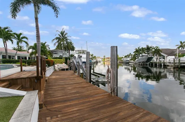 a park with water view and view of palm trees