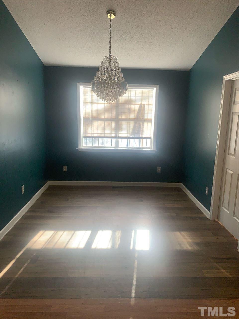 2201 Bufflehead Road Raleigh, NC 27616 - Photo 3 of 5 a view of empty room with wooden floor and window