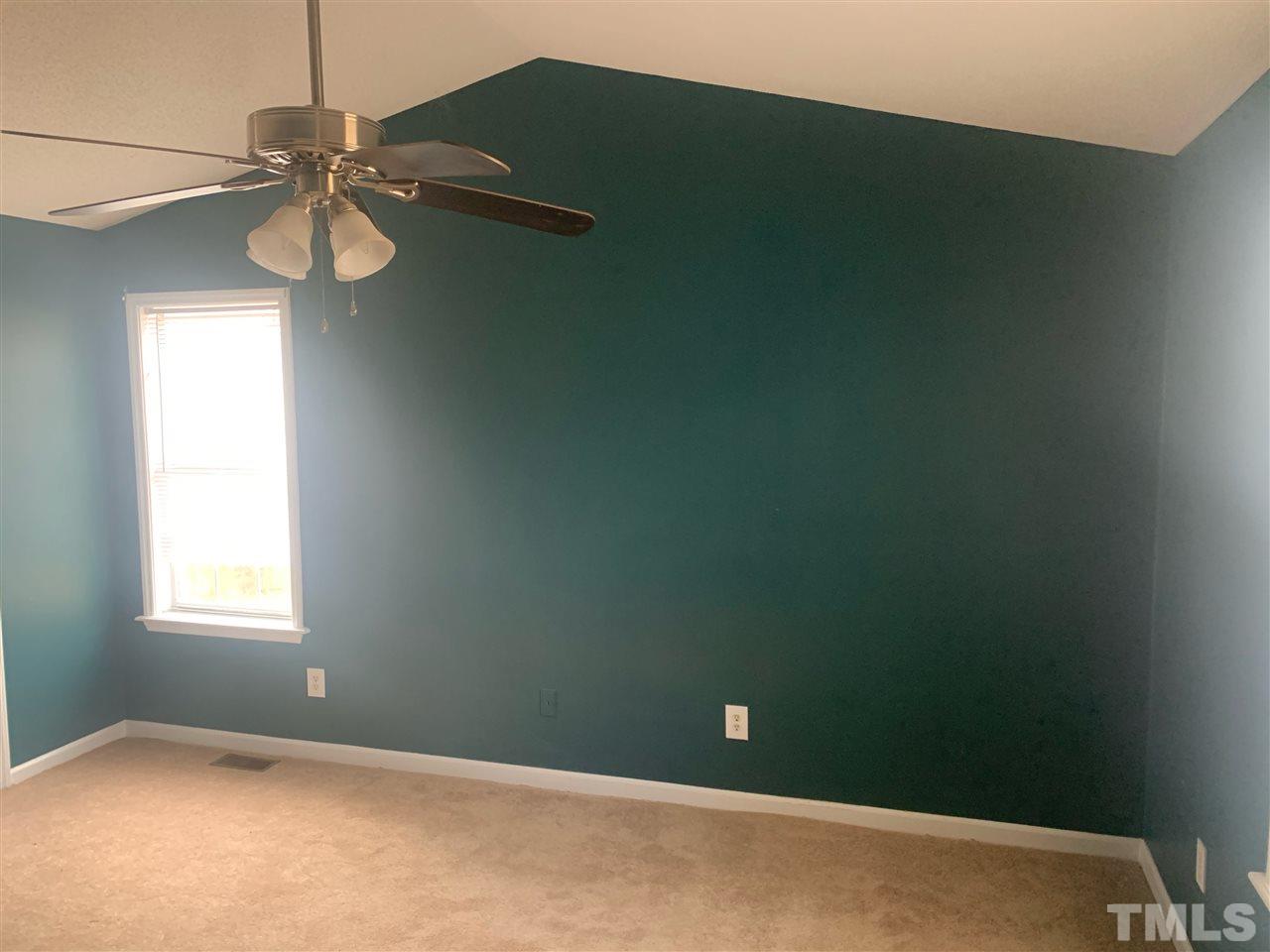 2201 Bufflehead Road Raleigh, NC 27616 - Photo 5 of 5 an empty room with a window