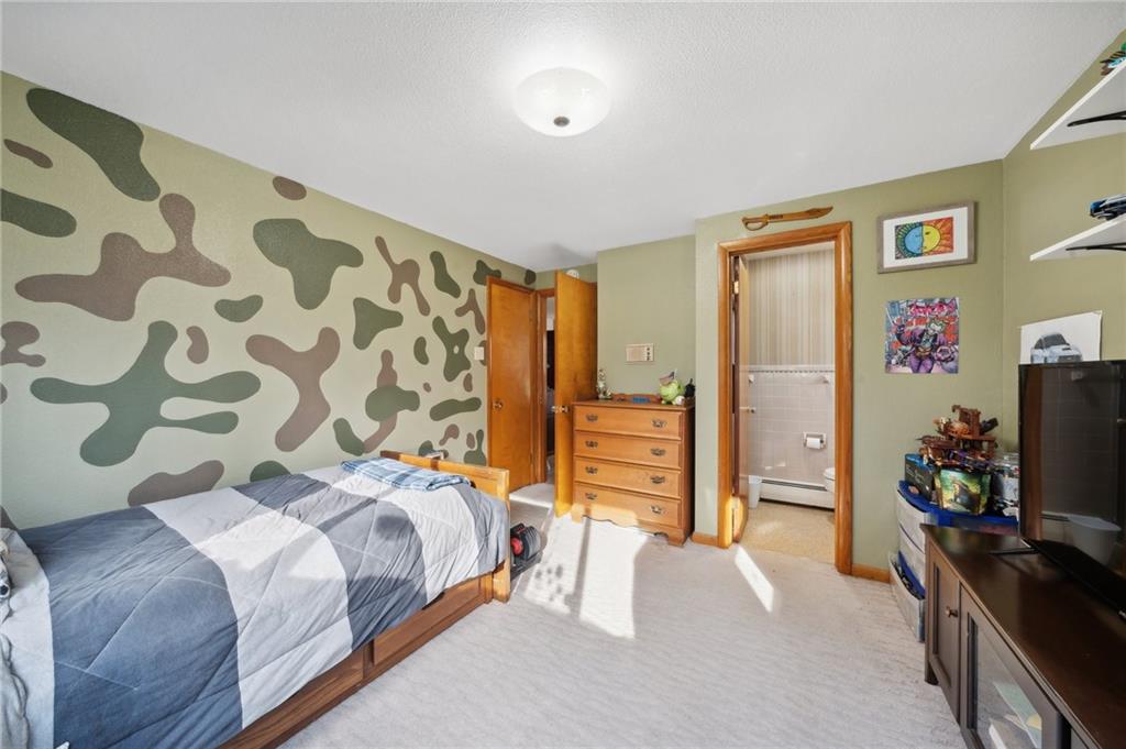 146 Jacobs Drive Boswell, PA 15531 - Photo 20 of 35 a bedroom with a bed and a flat screen tv