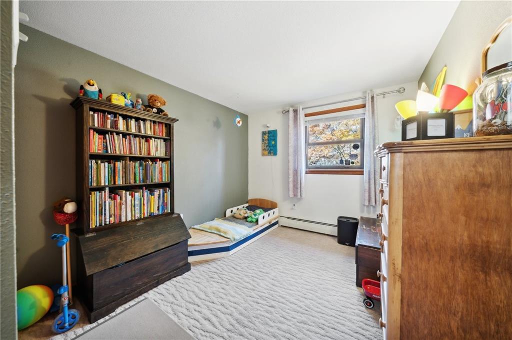 146 Jacobs Drive Boswell, PA 15531 - Photo 23 of 35 a bedroom with a bed and wooden floor