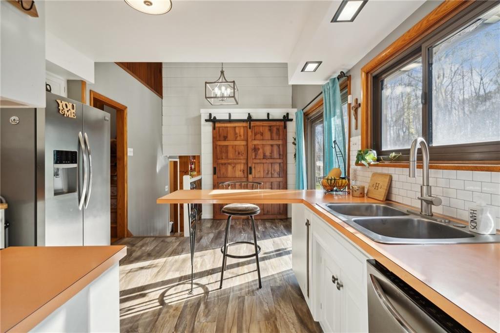 146 Jacobs Drive Boswell, PA 15531 - Photo 8 of 35 a kitchen with stainless steel appliances granite countertop a sink and a refrigerator