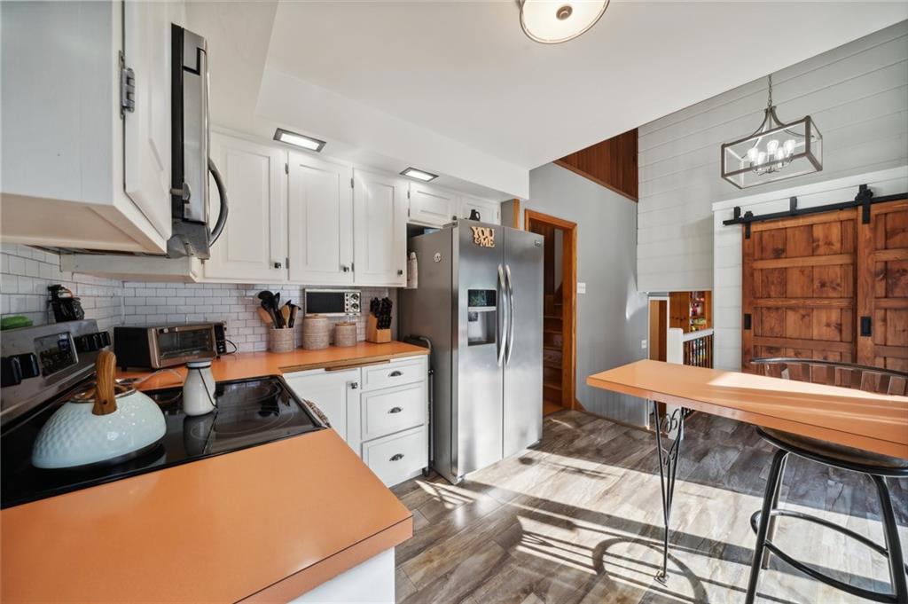 146 Jacobs Drive Boswell, PA 15531 - Photo 9 of 35 a room with stainless steel appliances kitchen island granite countertop furniture and a kitchen view