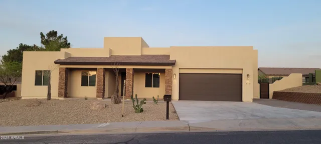 a front view of a house with yard