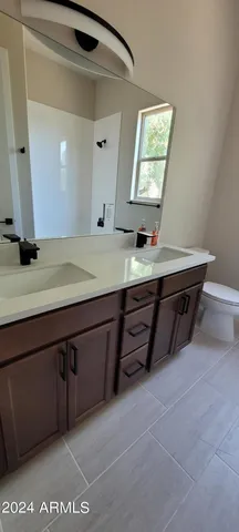 a room with a mirror and a sink
