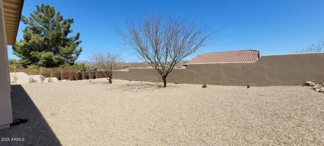 a view of back yard of the house