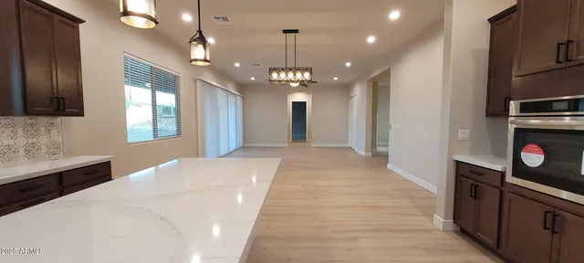 a spacious en suite bathroom with shower sink and mirror