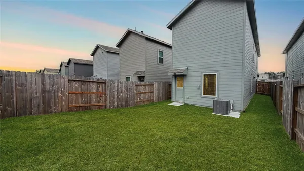 a view of a backyard of the house