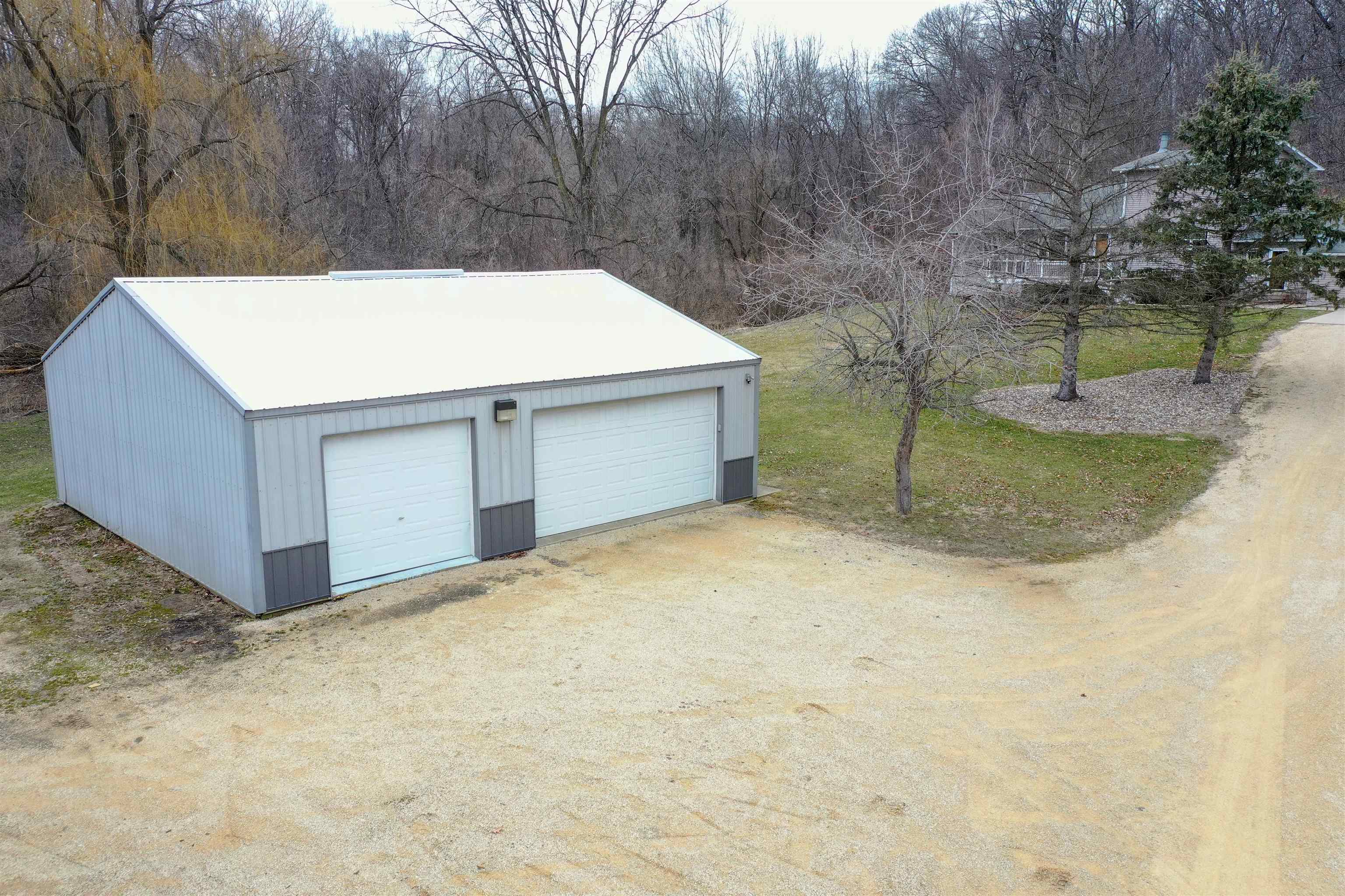 14407 3 Mile Road Mount Carroll, IL 61053 - Photo 29 of 65 a view of backyard and tree