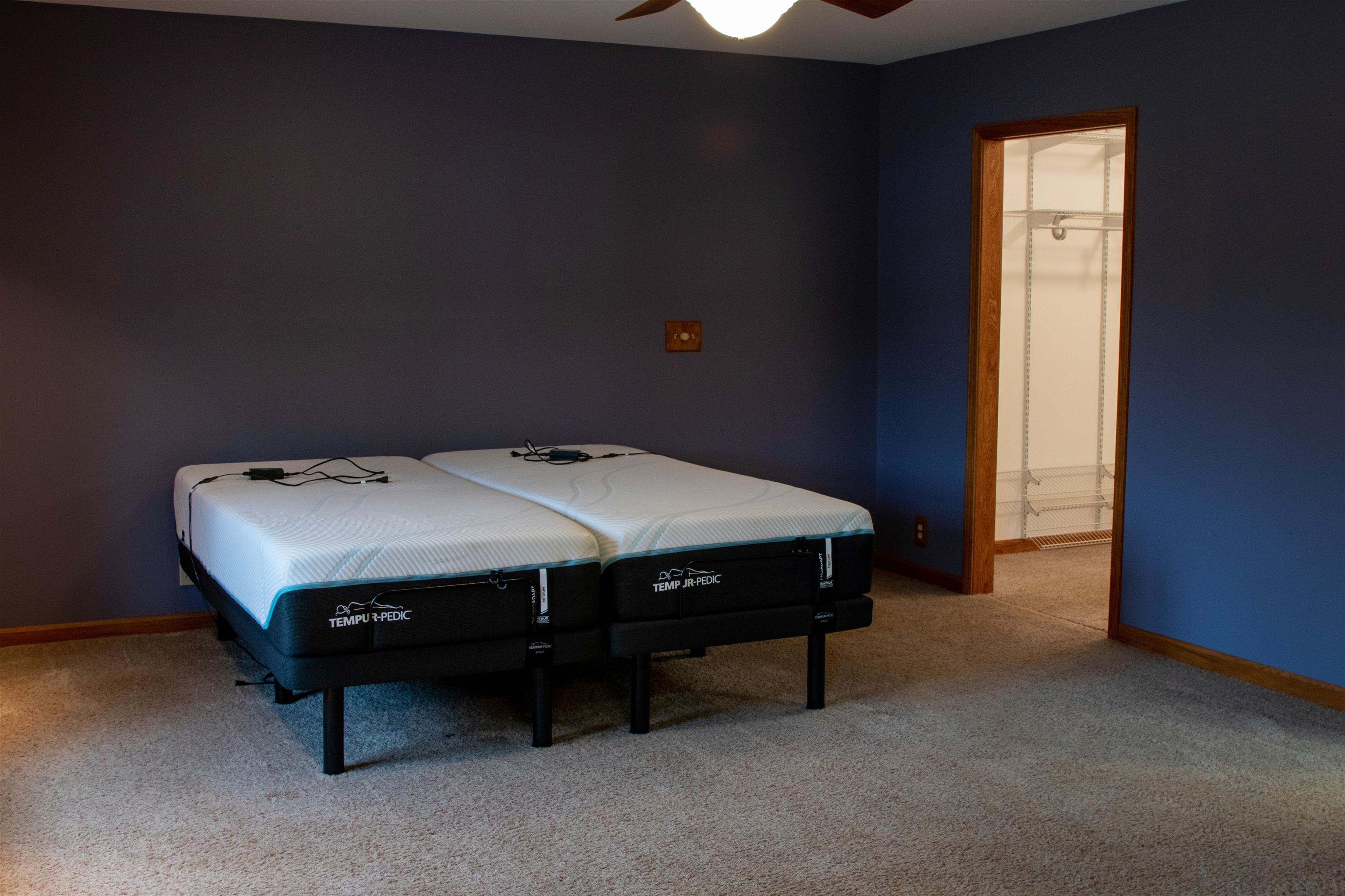 14407 3 Mile Road Mount Carroll, IL 61053 - Photo 54 of 65 a bed sitting in a room next to a window