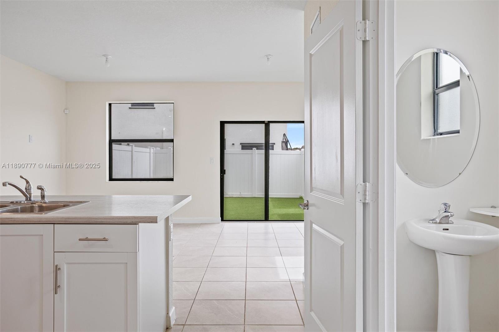 3411 West 112th Terrace Hialeah, FL 33018 - Photo 14 of 42 a bathroom with a sink and a mirror