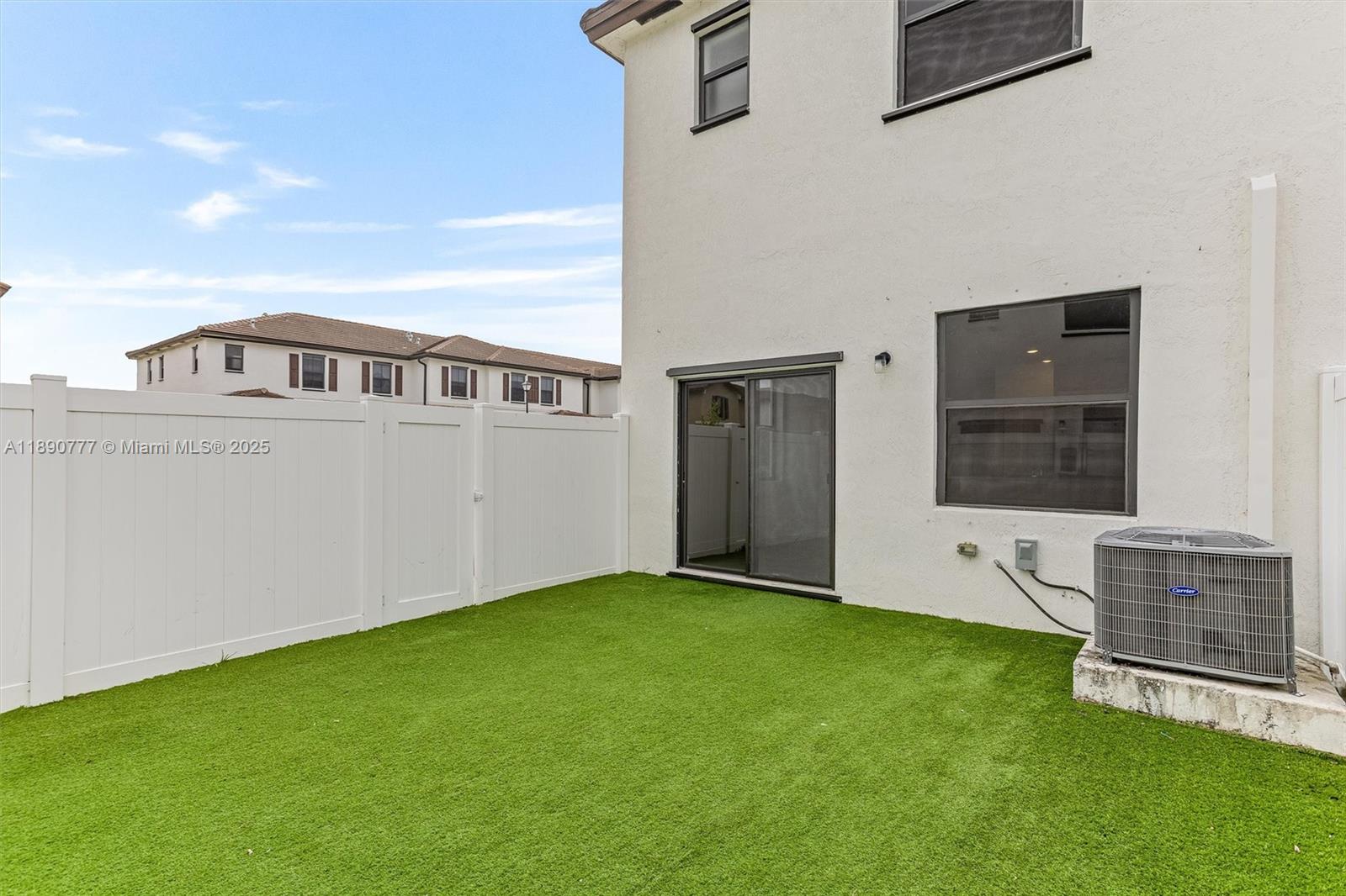 3411 West 112th Terrace Hialeah, FL 33018 - Photo 16 of 42 a view of an house with backyard space and balcony