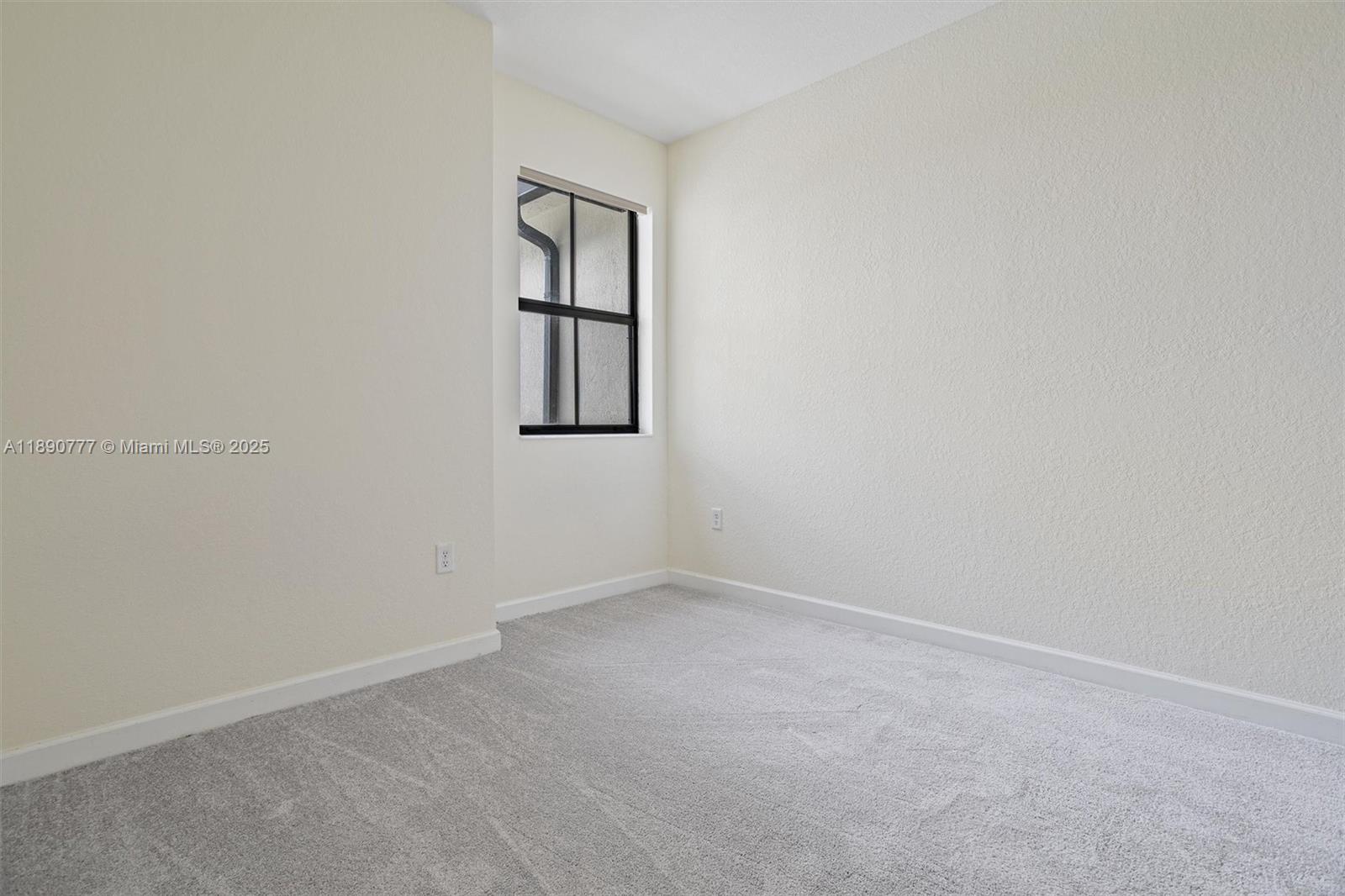 3411 West 112th Terrace Hialeah, FL 33018 - Photo 22 of 42 an empty room with windows and closet