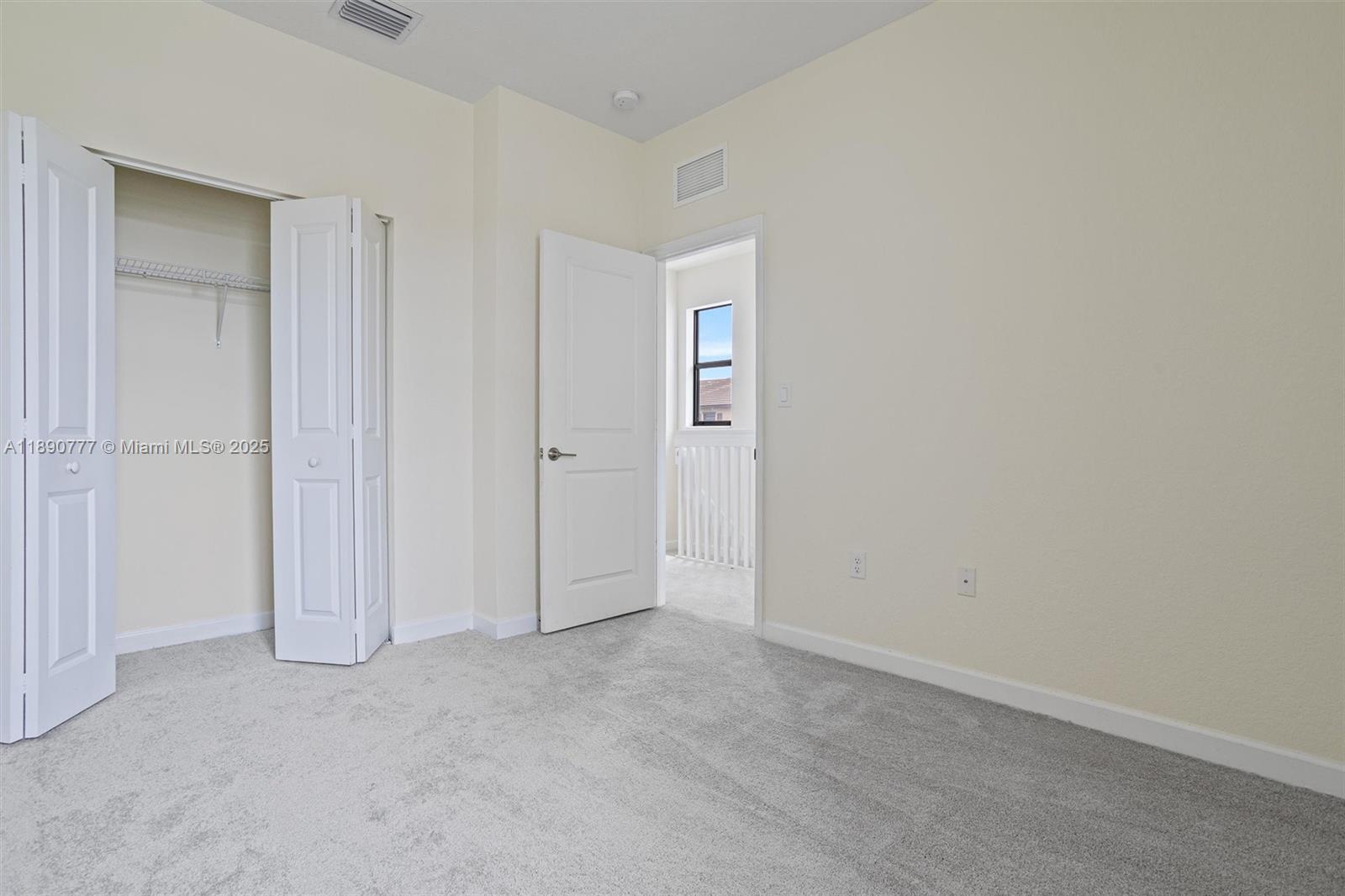 3411 West 112th Terrace Hialeah, FL 33018 - Photo 23 of 42 an empty room with closet area