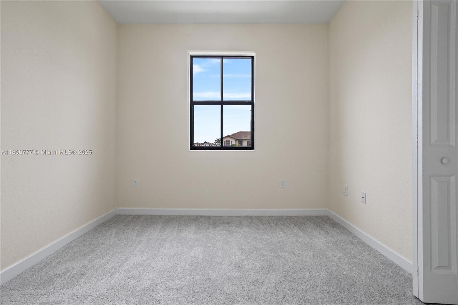 3411 West 112th Terrace Hialeah, FL 33018 - Photo 24 of 42 an empty room with a window