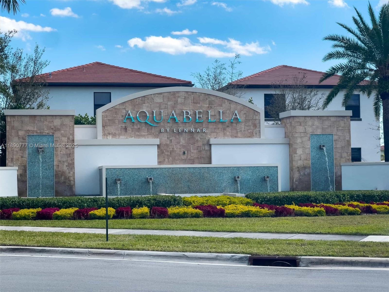 3411 West 112th Terrace Hialeah, FL 33018 - Photo 42 of 42 a front view of a house with a garden and yard
