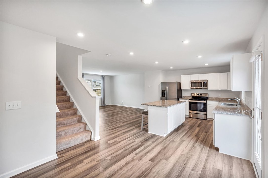150 Queens Mill Court Pendleton, SC 29670 - Photo 11 of 37 This open concept space offers seamless transitions between the kitchen and living areas.