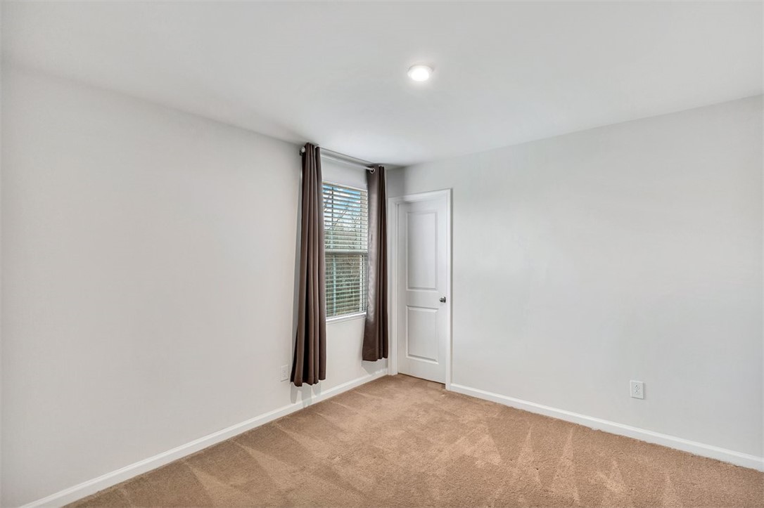 150 Queens Mill Court Pendleton, SC 29670 - Photo 15 of 37 This spacious bedroom offers a neutral canvas ready for your personal touch and design preferences.
