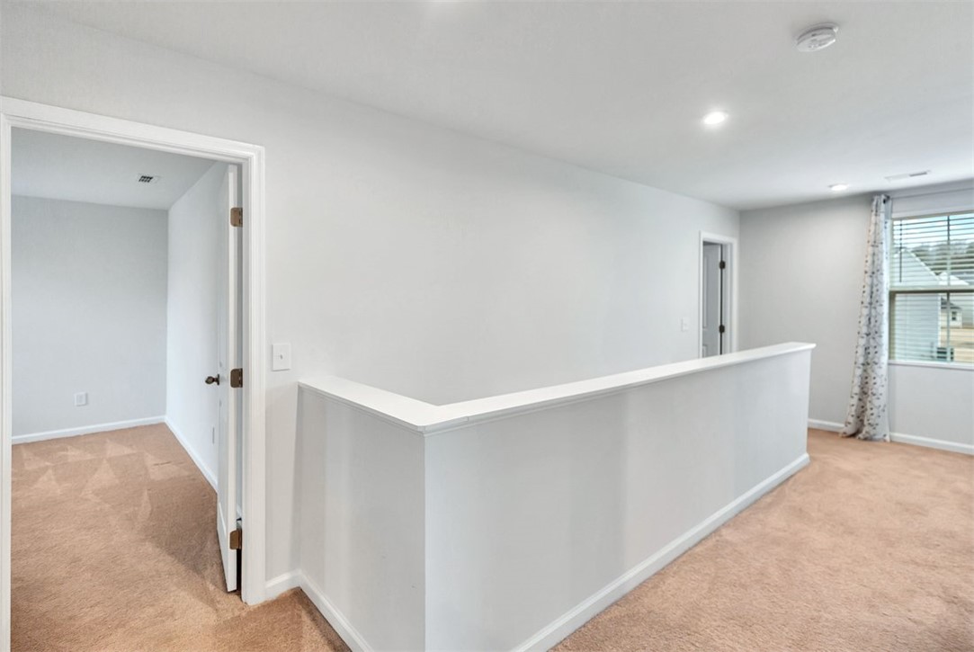 150 Queens Mill Court Pendleton, SC 29670 - Photo 18 of 37 This bright hallway offers an inviting atmosphere with ample natural light.