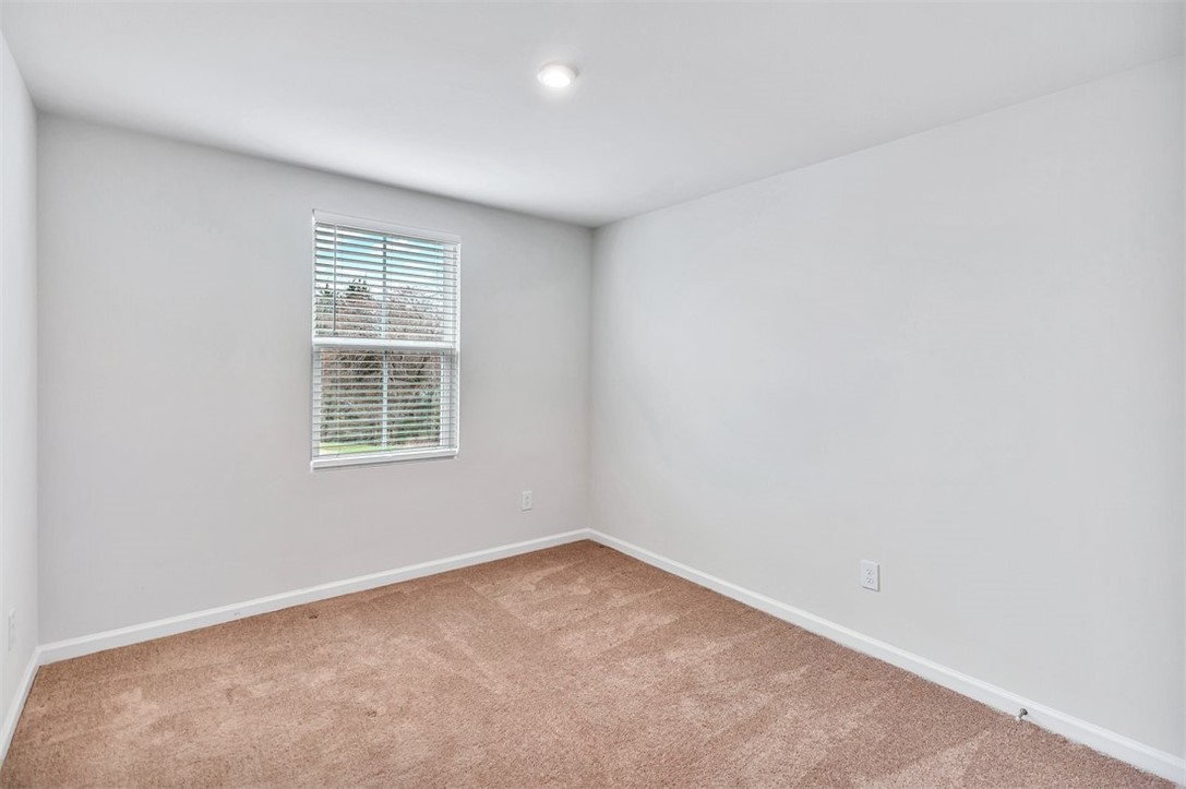 150 Queens Mill Court Pendleton, SC 29670 - Photo 19 of 37 This spacious bedroom offers ample natural light and a clean, comfortable living space.