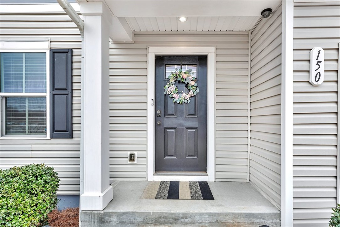 150 Queens Mill Court Pendleton, SC 29670 - Photo 2 of 37 The inviting entrance features durable siding and a welcoming porch, perfect for greeting guests.
