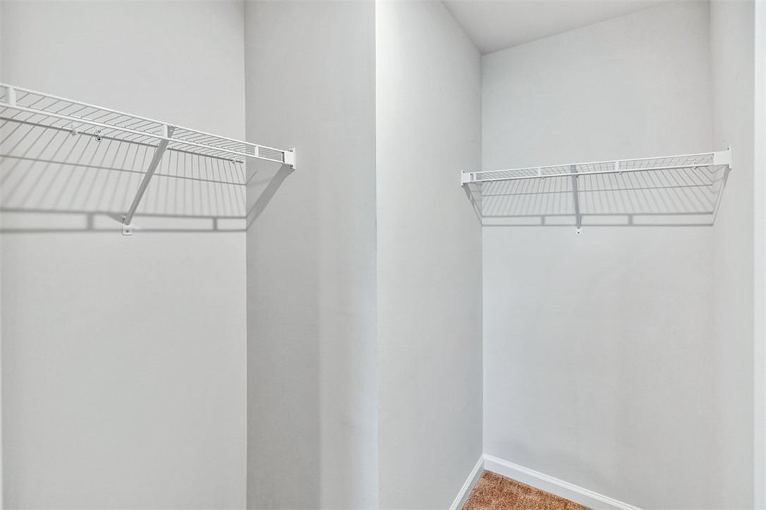 150 Queens Mill Court Pendleton, SC 29670 - Photo 22 of 37 This spacious closet features ample storage with shelving, perfect for organization.