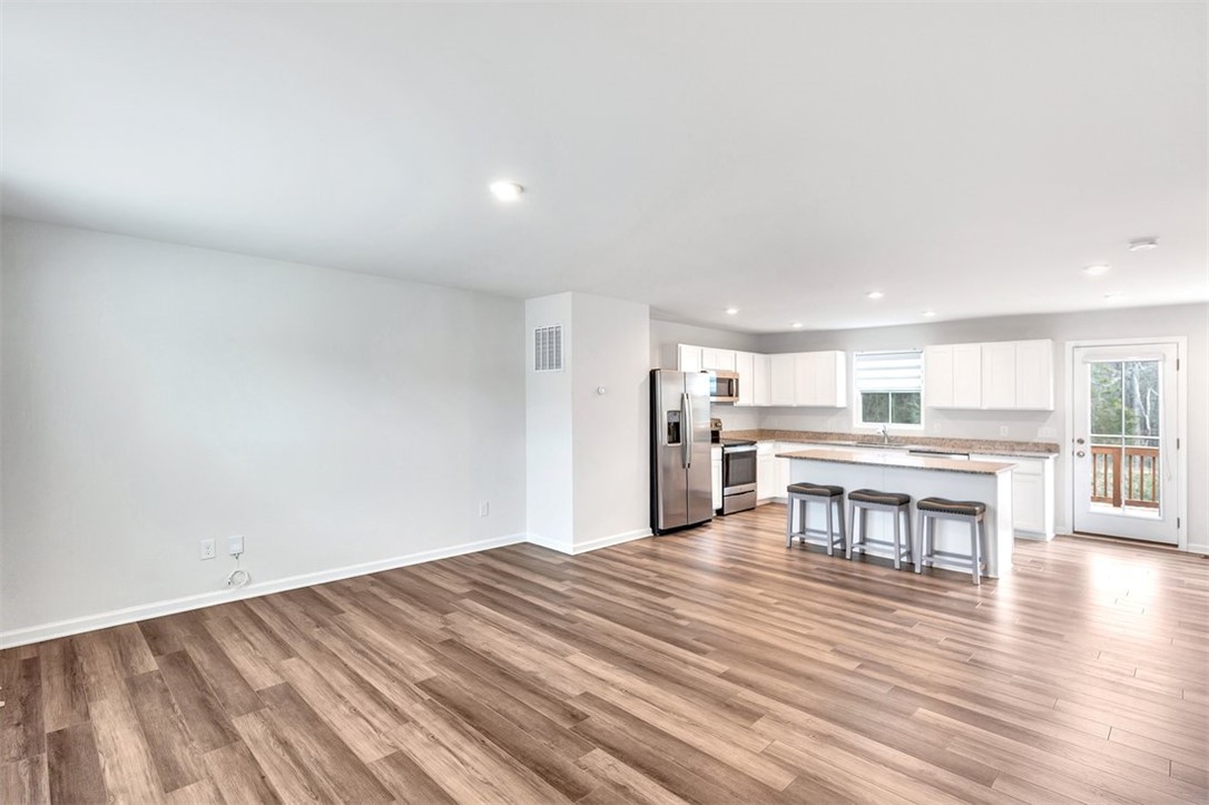 150 Queens Mill Court Pendleton, SC 29670 - Photo 3 of 37 This bright, open-concept space features a well-appointed kitchen and direct access to outdoor living.