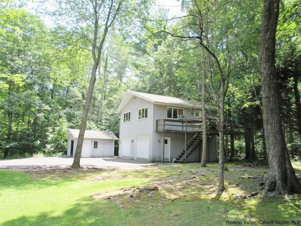 48 Saxton Flats Road Saugerties, NY 12477 - Photo 15 of 21 a view of a house with a yard covered in the forest