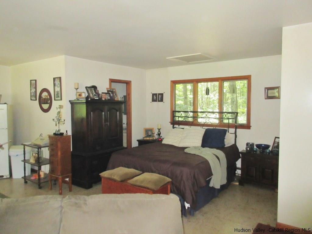 48 Saxton Flats Road Saugerties, NY 12477 - Photo 17 of 21 a bedroom with a bed and a window