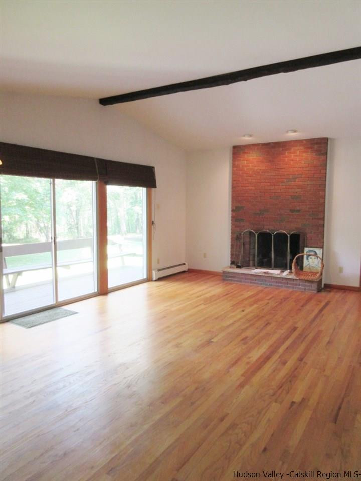 48 Saxton Flats Road Saugerties, NY 12477 - Photo 8 of 21 an empty room with wooden floor and windows