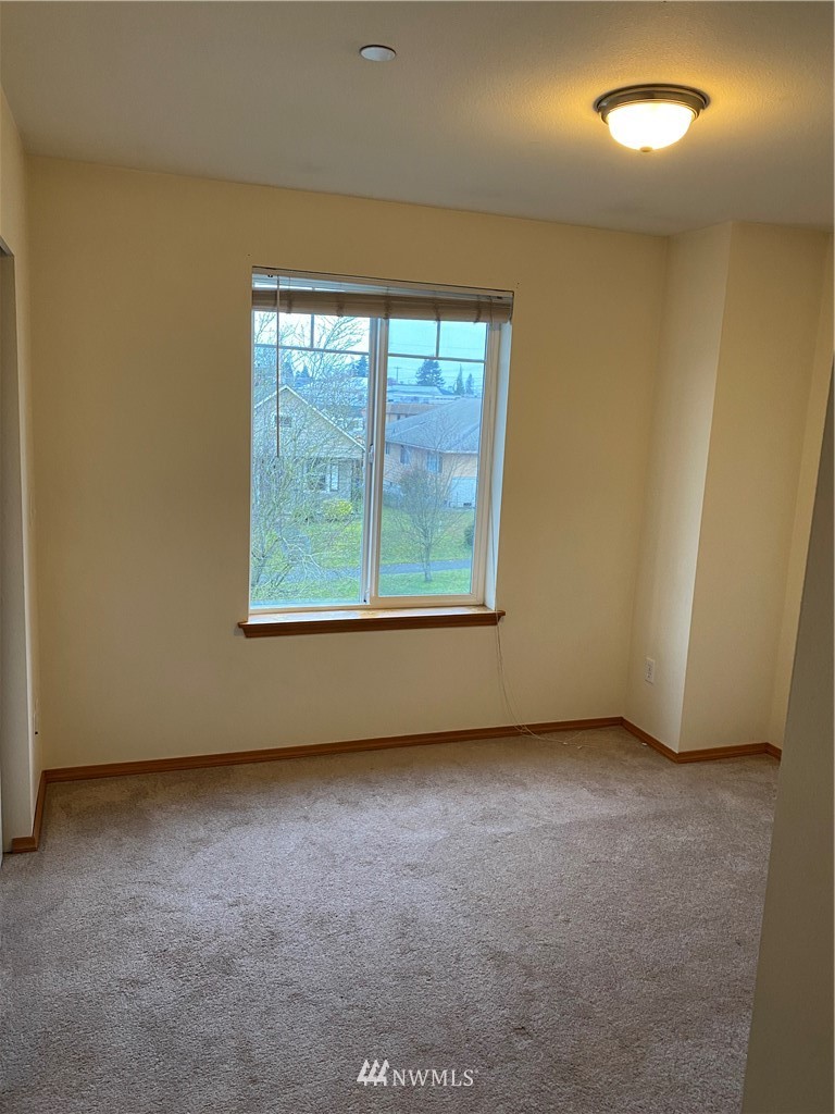 3319 Rockefeller Avenue Everett, WA 98201 - Photo 7 of 7 an empty room with windows