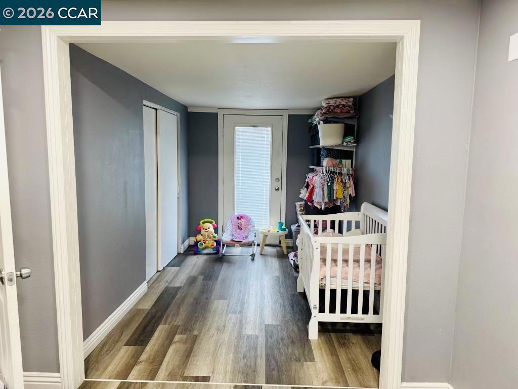 4400 Gateway Road Bethel Island, CA 94511 - Photo 2 of 6 a bedroom with furniture and wooden floor
