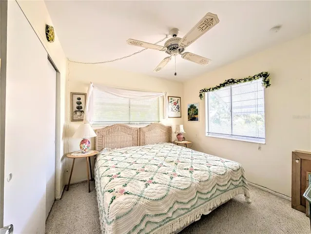 a bedroom with a bed and a mirror