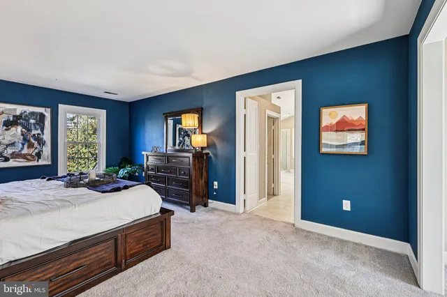 a spacious bathroom with a tub shower and sink