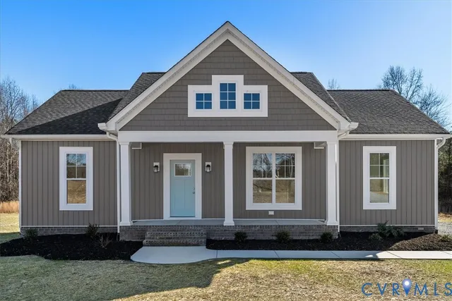 a large kitchen with granite countertop a stove a sink dishwasher and a refrigerator