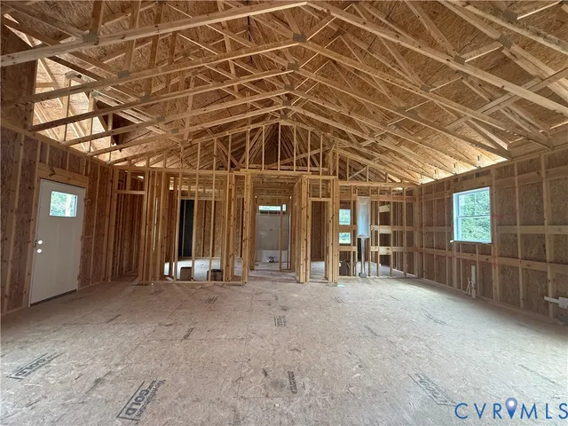 a view of a room with wooden ceiling