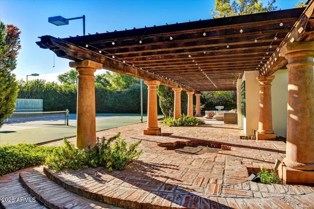 a view of a porch with furniture and yard