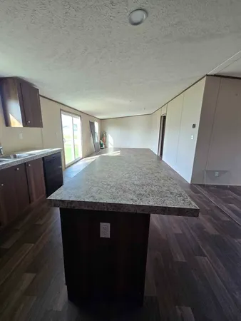 a view of kitchen island with wooden floor