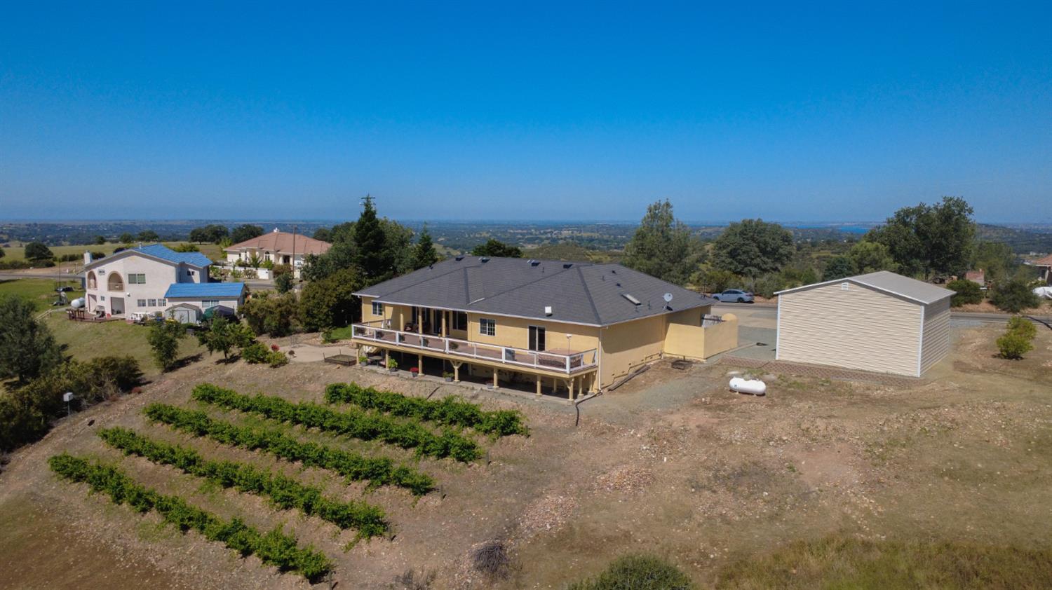 3235 Hagen Road Valley Springs, CA 95252 - Photo 2 of 56 an aerial view of a house with a yard and lake view