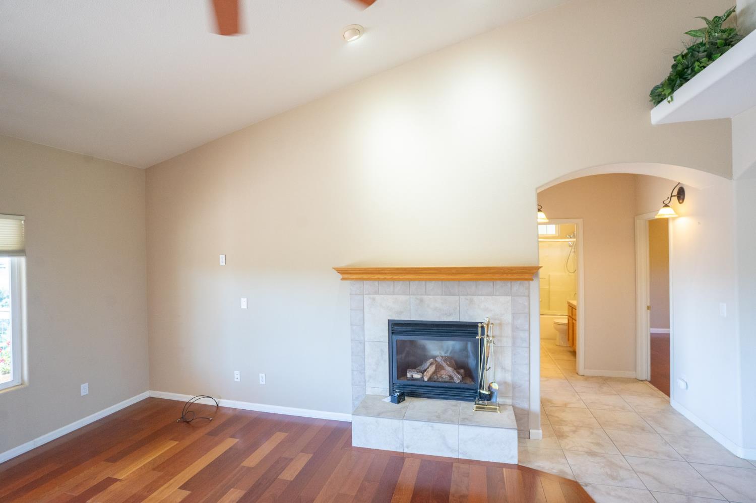 3235 Hagen Road Valley Springs, CA 95252 - Photo 8 of 56 a view of an empty room with a fireplace and a window