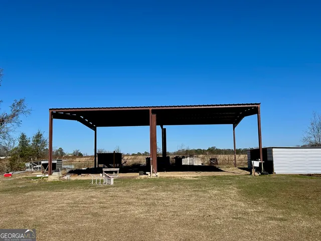 a view of backyard with seating space